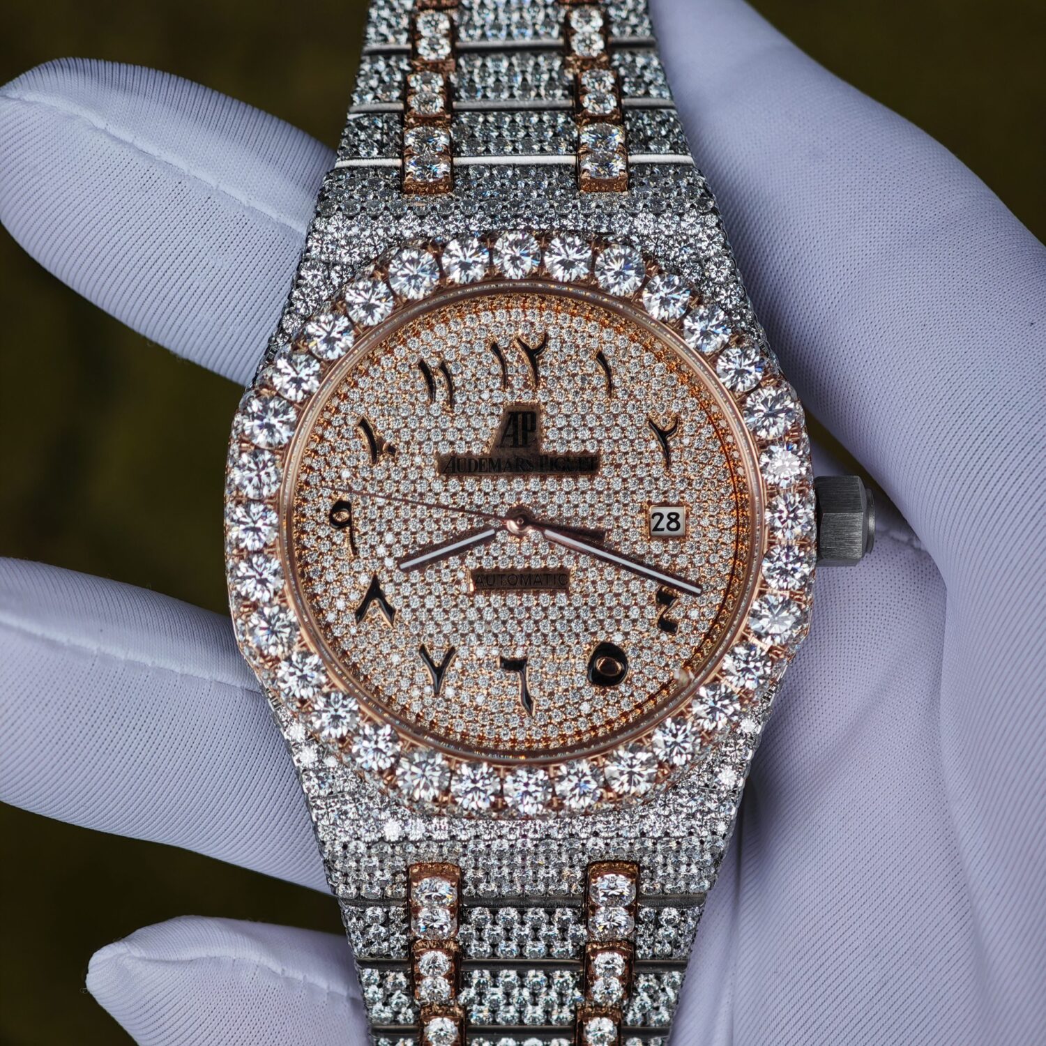 Customized rose gold color scheme with full diamond Audemars Piguet AP15400, the case and strap are handcrafted with natural diamonds using Swiss craftsmanship, a customized full diamond Middle Eastern digital dial, and the best 3120 integrated movement. — custom-built watch