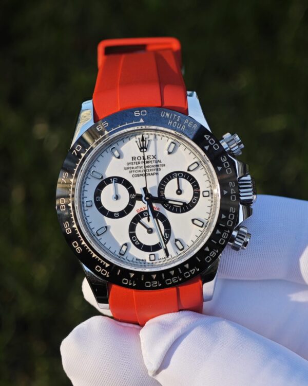 Rolex Daytona 116500 Panda, custom imported dial, hands, and ceramic bezel. The case has undergone secondary polishing, paired with a red fluororubber strap and equipped with a Dandong 4130 integrated movement — custom-built watch