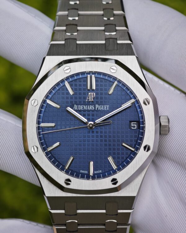 The Audemars Piguet Royal Oak AP15500 with a blue dial features a top-tier replacement dial, hands, date wheel, and polished solid hand pinion, all meticulously assembled following Swiss craftsmanship. The case and bracelet have undergone secondary polishing and finishing, and are powered by a 4302 integrated movement that has been buildd from the original specifications. — custom-built watch